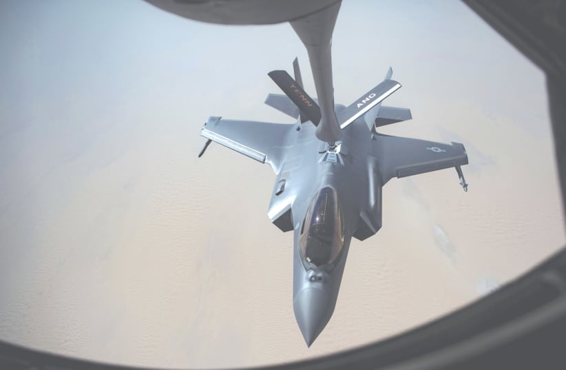 AN AIRMAN piloting a US Air Force F-35A Lightning II receives fuel from a KC-135 Stratotanker at an undisclosed location in Southwest Asia earlier this week. (photo credit: KEIFER BOWES/US AIR FORCE/REUTERS)