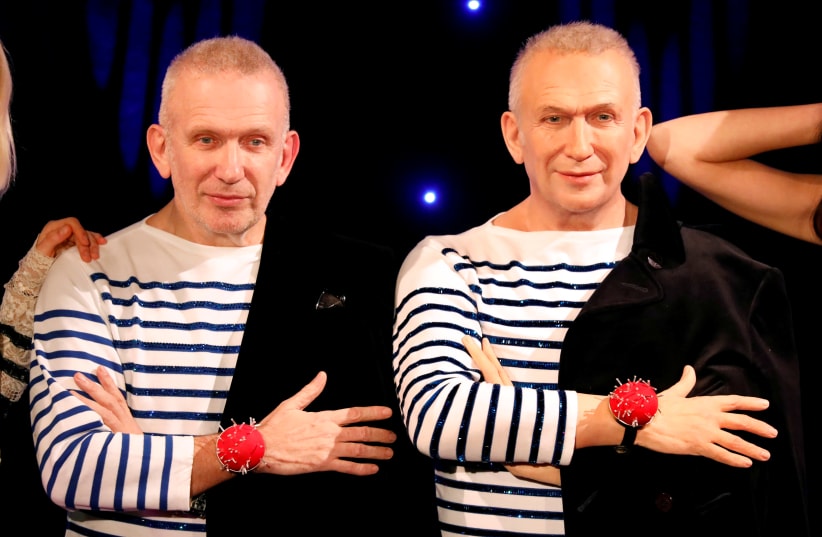 French fashion designer Jean-Paul Gaultier (L) stands next to his figure made by French sculptor Eric Saint Chaffray at the Grevin wax museum during the presentation of his waxwork in Paris, France, December 18, 2017 (photo credit: CHARLES PLATIAU / REUTERS)
