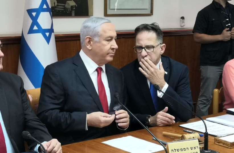 Prime Minister Benjamin Netanyahu talks to Cabinet Secretary Tzachi Braverman at the cabinet meeting (photo credit: YANIR COZIN / MAARIV)