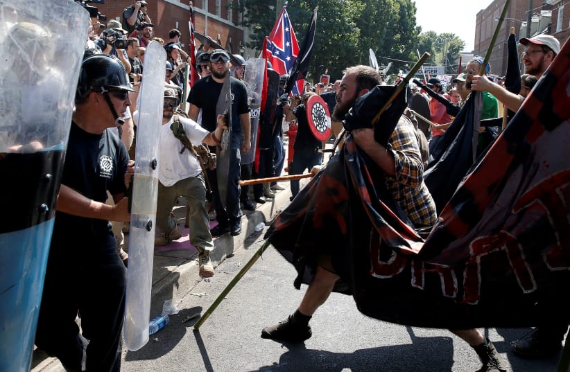 White supremacists clash with counter protesters at a rally in Charlottesville, Virginia, U.S., August 12, 2017 (photo credit: REUTERS/JOSHUA ROBERTS)