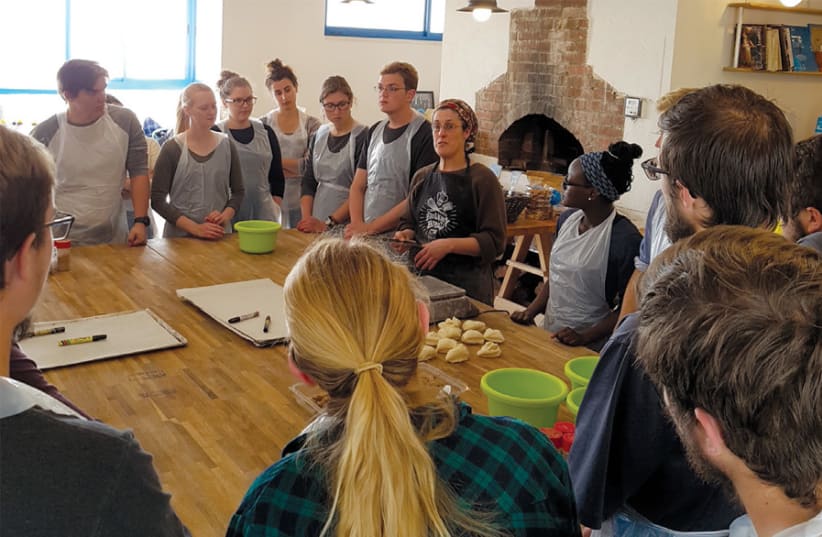 STUDENTS LEARN to make bread at Pat Bamelach in Gush Etzion. (photo credit: Courtesy)