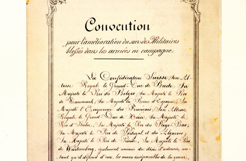 THe 1864 Geneva Convention, the first codified international treaty that covered sick and wounded soldiers on the battlefield (first page). (photo credit: ICRC/FLICKR)