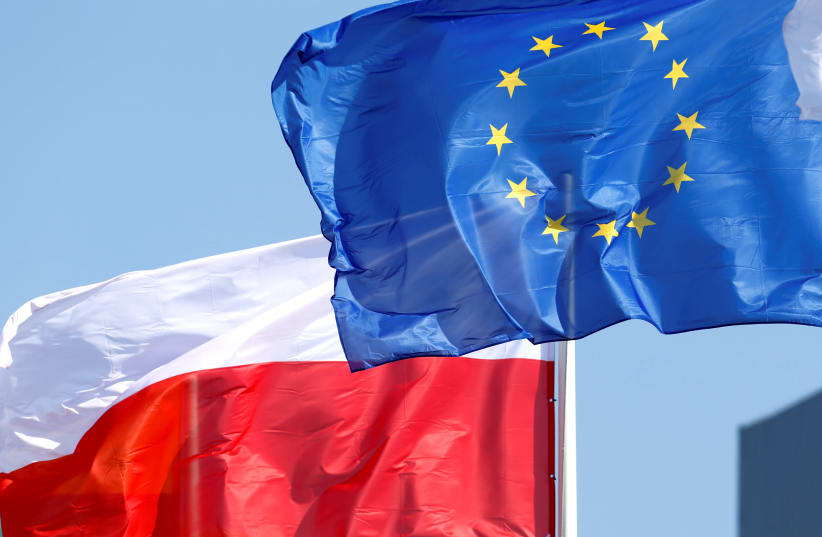 European Union and Poland's flags flutter (photo credit: INTS KALNINS / REUTERS)