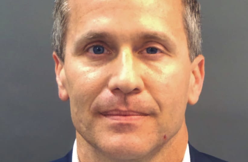 Missouri Governor Eric Greitens appears in a police booking photo in St. Louis (photo credit: HANDOUT/REUTERS)