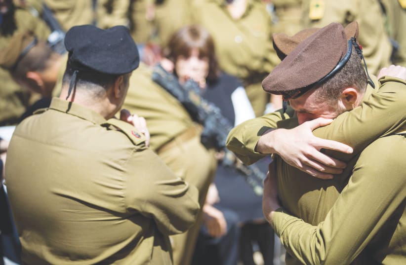FRIENDS AND FAMILY mourn at the funeral of American lone soldier Alex Sasaki at the Mount Herzl Military Cemetery in Jerusalem, in March.  (photo credit: YONATAN SINDEL/FLASH 90)