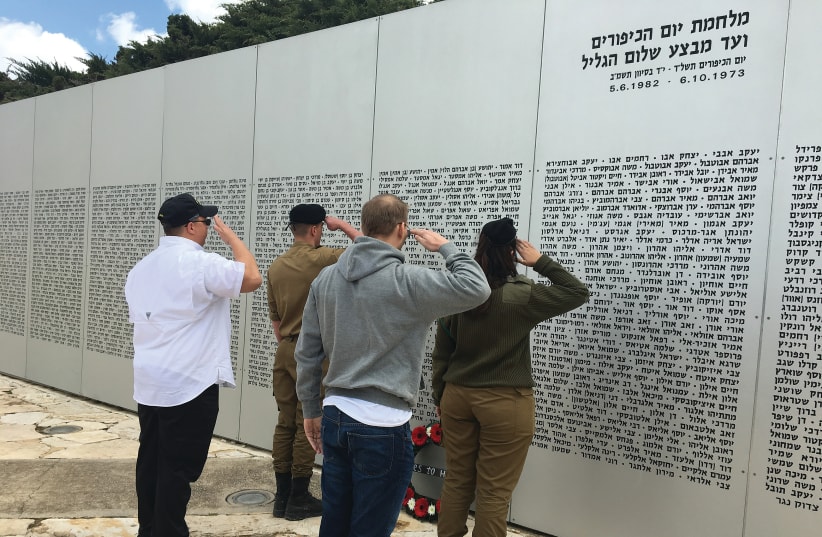 Heroes to Heroes participants with their Israeli counterparts lay a wreath at the Latrun Armored Corps Memorial. (photo credit: Courtesy)