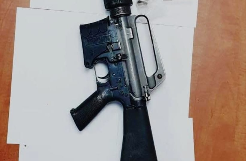 M-16 rifle seized in a police raid (photo credit: POLICE SPOKESPERSON'S UNIT)