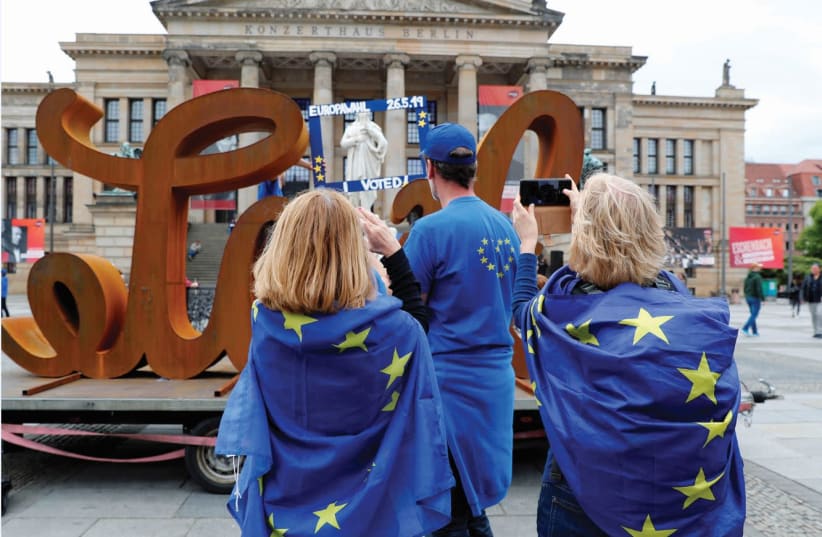 GERMANS IN European flags enjoy a peaceful day.  (photo credit: REUTERS)