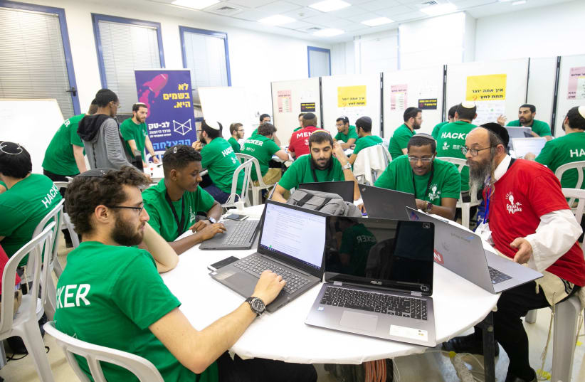 Jerusalem College of Technology students at work during the May 2019 hackathon (photo credit: MICHAEL ERENBURG)