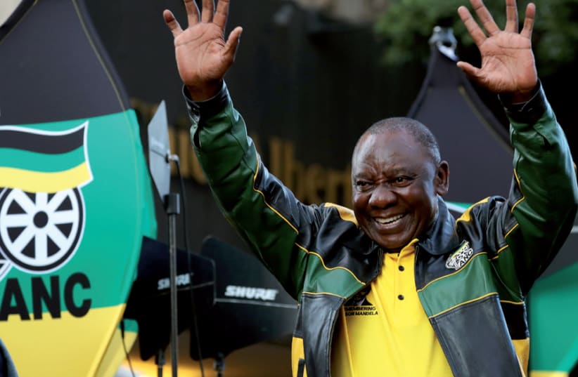 South African President Cyril Ramaphosa waves to supporters of his ruling ANC at an election victory rally in Johannesburg on May 12 (photo credit: MIKE HUTCHINGS / REUTERS)