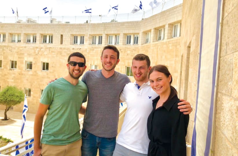 Mikey, Max, Gamliel and Alena on the celebrated balcony of the Jewish Agency building where David Ben-Gurion stood on November 29, 1947, as the UN voted in favor of the establishment of a Jewish state which they have now come to defend. (photo credit: Courtesy)