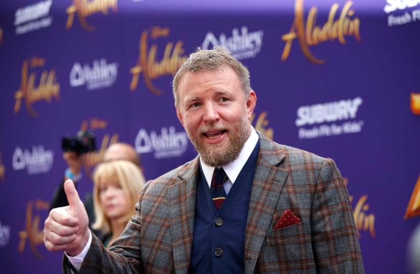 Director Guy Ritchie arrives for the premiere of "Aladdin" at El Capitan theatre in Los Angeles, California, US. (photo credit: MARIO ANZUONI/REUTERS)