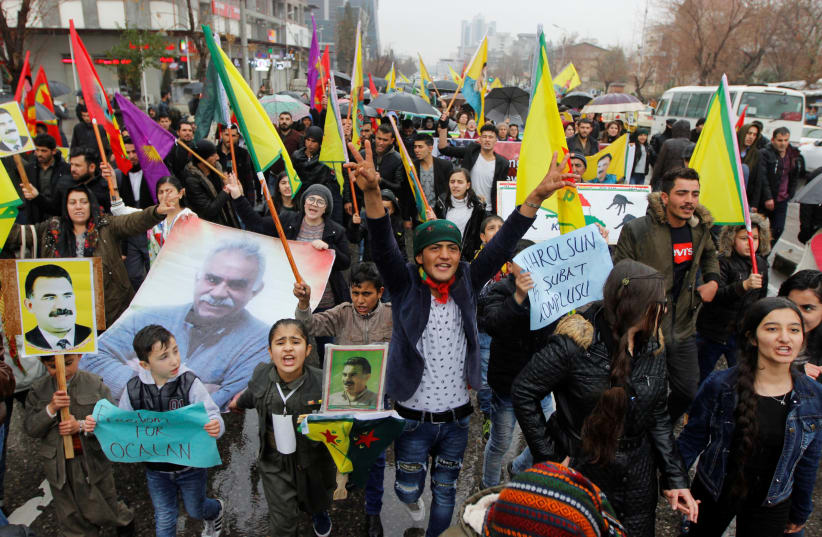 Kurdish demonstrators shout slogans during a protest demanding the release of the Kurdistan Workers Party (PKK) leader Abdullah Ocalan, in Sulaimaniyah, Iraq February 16, 2018 (photo credit: AKO RASHEED / REUTERS)