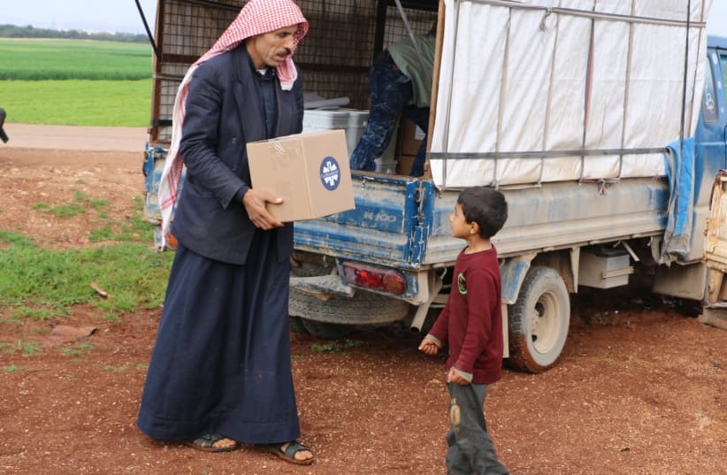 Syrian refugees in Aleppo receive aid with the help of Jewish students at Vassar College and Multifaith Alliance for Syrian Refugees (photo credit: MULTIFAITH ALLIANCE FOR SYRIAN REFUGEES (MFA))