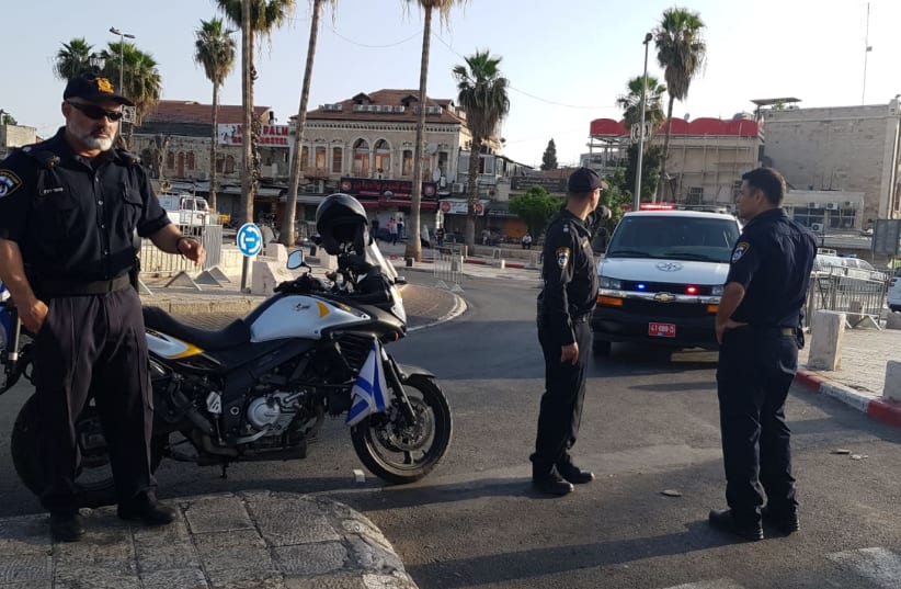 Police stand near the site of a terrorist attack at Damascus Gate (photo credit: ISRAEL POLICE)