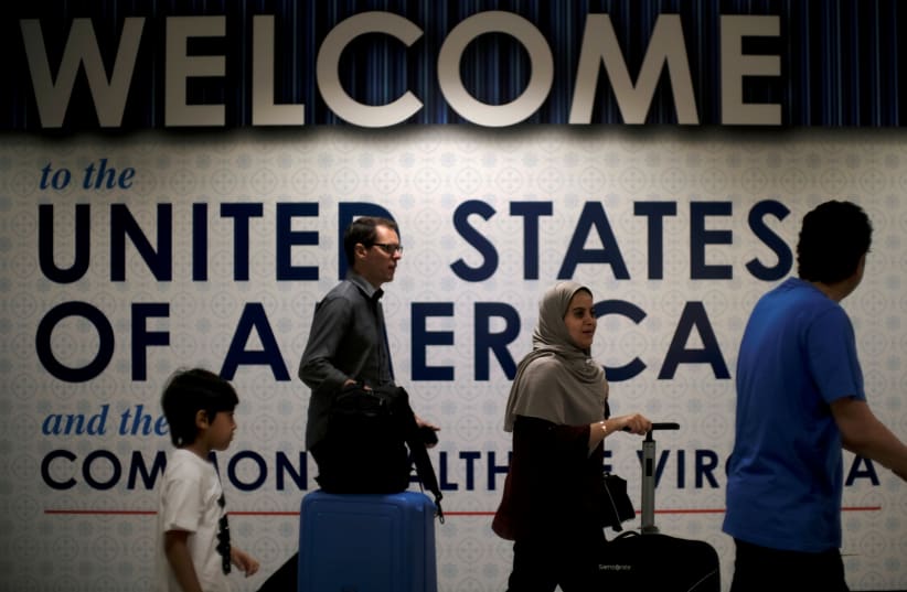 International passengers arrive at Washington Dulles International Airport (photo credit: REUTERS/JAMES LAWLER DUGGAN)