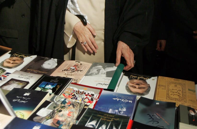 Iran's supreme leader Ayatollah Khamenei views bookstand in Tehran (photo credit: REUTERS/STRINGER IRAN)