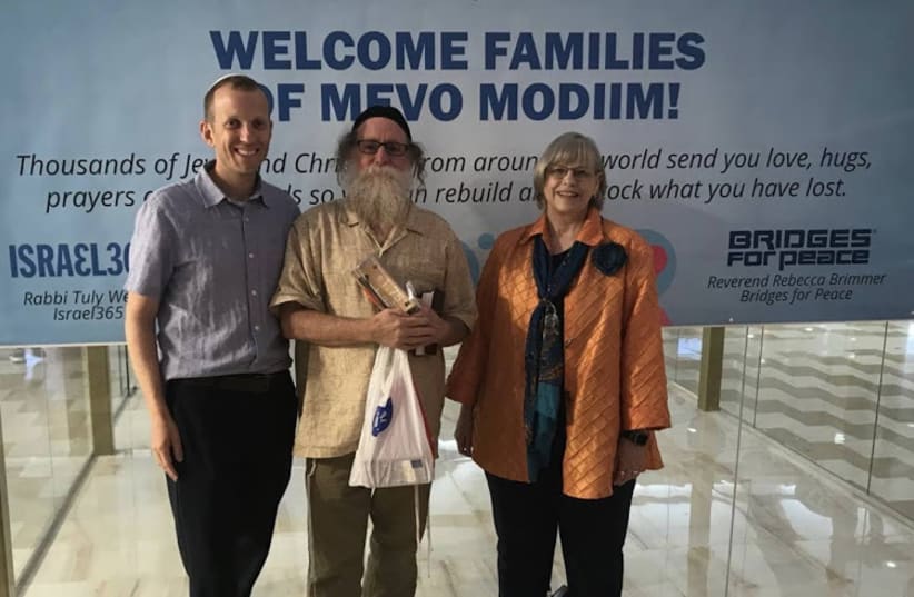 From left: Rabbi Tuly Weisz, moshav resident Shalom Shwartz and Bridges for Peace head Rebecca Brimmer (photo credit: ISRAEL365/BRIDGES FOR PEACE)