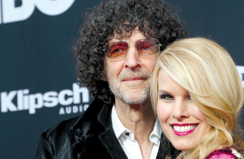 HOWARD STERN and his wife, Beth Ostrosky Stern, at the Rock & Roll Hall of Fame in Cleveland, Ohio, last year. (photo credit: REUTERS/AARON JOSEFCZYK)