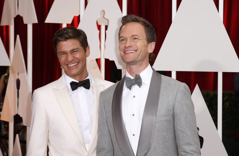 Oscars host Neil Patrick Harris (R) and his husband David Burtka arrive at the 87th Academy Awards in Hollywood, California  (photo credit: LUCAS JACKSON / REUTERS)