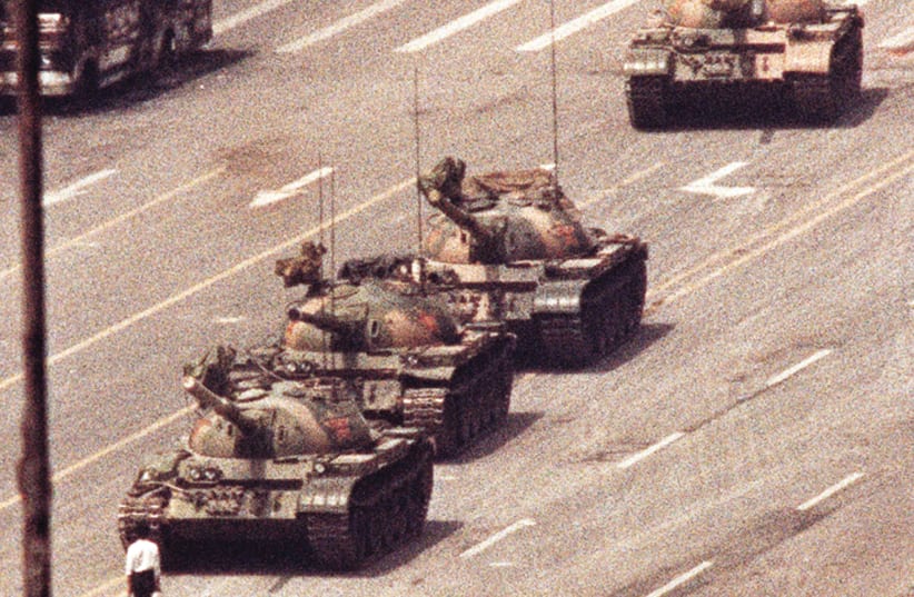 THE ICONIC PHOTO of a man standing in front of a convoy of tanks in the Avenue of Eternal Peace in Beijing, China, June 5, 1989.  (photo credit: REUTERS)
