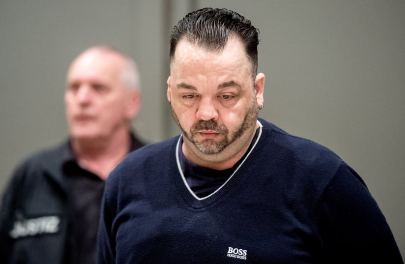 Niels Hoegel, accused of murdering 100 patients at the clinics in Delmenhorst and Oldenburg, attends his trial in Oldenburg, Germany June 6, 2019. (photo credit: HAUKE CHRISTIAN DITTRICH/ REUTERS)