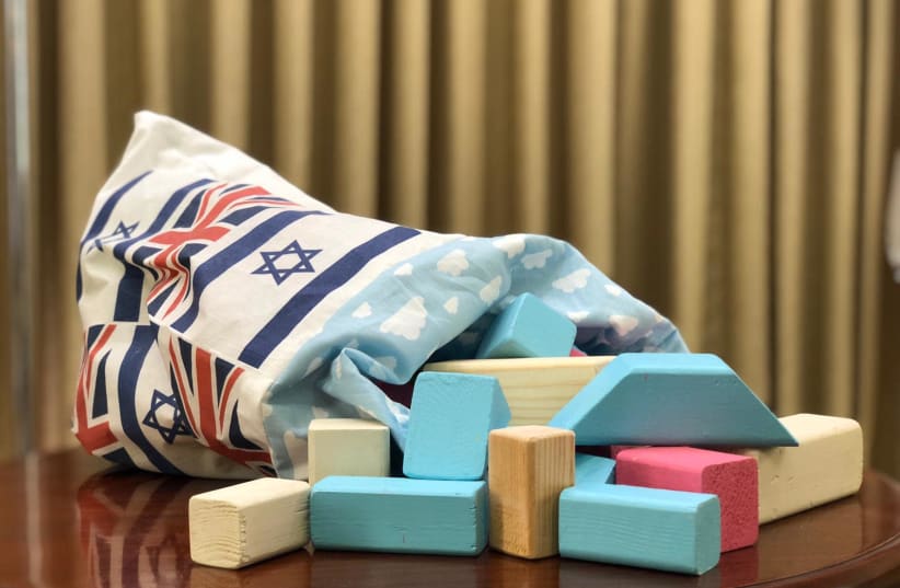 A set of wooden blocks presented to the newborn son of Prince Harry and Meghan Markle, the Duke and Duchess of Sussex, by the Rivlin family (photo credit: PRESIDENT RESIDENCE)