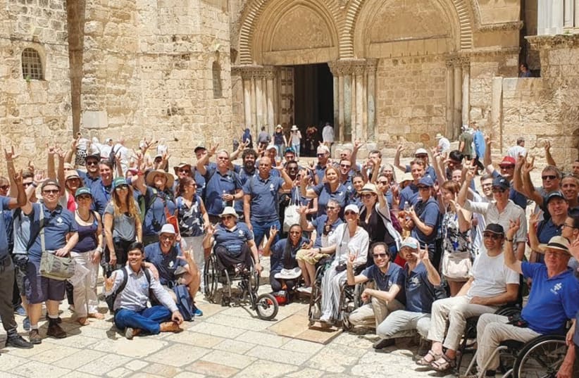 ATTENDEES OF the Access Israel ‘Future of Accessibility’ conference visit the Old City in Jerusalem.  (photo credit: HOWARD BLAS)