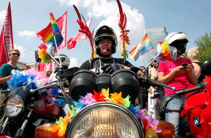 A participant rides a motorbike during the EuroPride 2010 parade through the streets of Warsaw (photo credit: REUTERS)