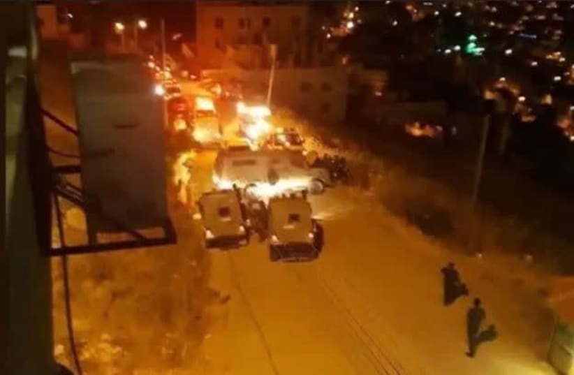 IDF forces face Palestinian Preventive Security forces in Nablus (photo credit: ARAB MEDIA)
