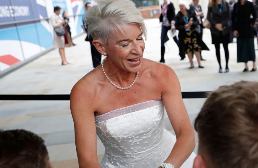 Newspaper columnist Katie Hopkins arrives dressed in a wedding dress at the Conservative Party's conference in Manchester, Britain October 2, 2017 (photo credit: PHIL NOBLE/REUTERS)