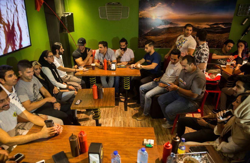 Iranian young people gather at a restaurant in west Tehran (photo credit: REUTERS PHOTOGRAPHER)