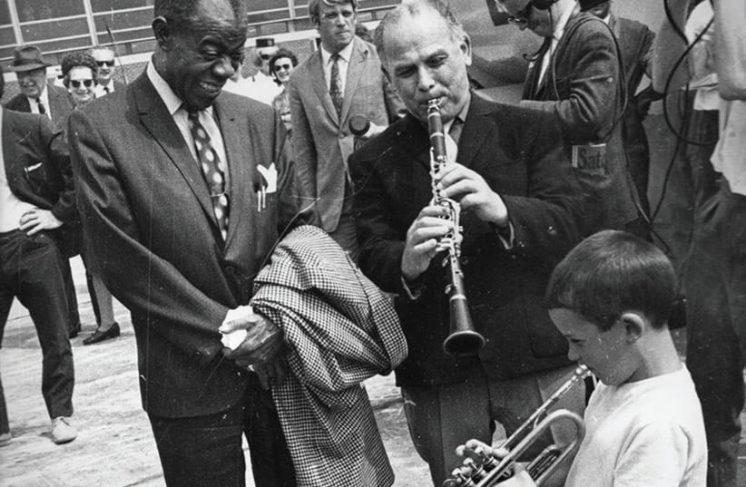 TOMMASO WITH ARMSTRONG On Daily Express, 1968 (photo credit: COURTESY OF THE LOUIS ARMSTRONG ARCHIVES)