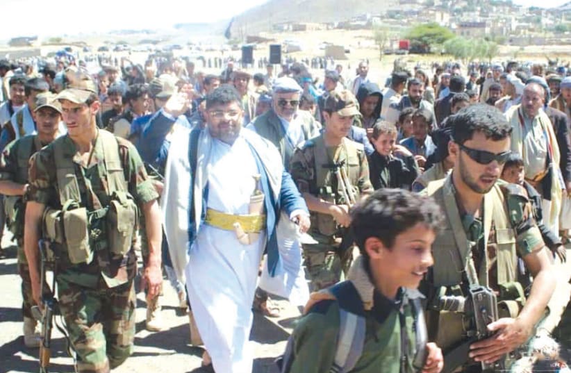 MOHAMMED ALI AL-HOUTHI (center), head of the Houthi Supreme Revolutionary Committee, surrounded by children as shields. (photo credit: MINISTRY OF INFORMATION - REPUBLIC OF YEMEN)