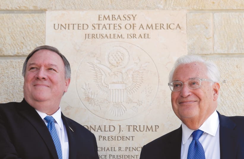 US SECRETARY OF State Mike Pompeo and US Ambassador to Israel David Friedman stand next to the dedication plaque at the US Embassy in Jerusalem in March (photo credit: JIM YOUNG/REUTERS)