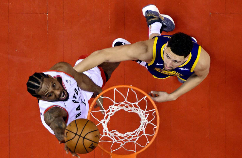 Toronto Raptors forward Kawhi Leonard (2) shoots the ball against Golden State Warriors guard Klay Thompson (11) in game five of the 2019 NBA Finals at Scotiabank Arena (photo credit: REUTERS)