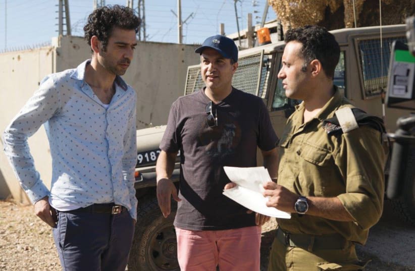 ‘TEL AVIV ON FIRE’ director Sameh Zoabi (center) with actors Kais Nashif (left) and Yaniv Biton (photo credit: PATRICIA IBANEZ)