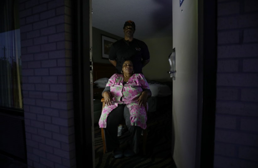 Laurie Jones, 57, and her husband, Joe Jones, 59, from Johnsonville, SC during a power outage caused by Hurricane Florence in Florence, South Carolina, U.S., September 14, 2018. Picture taken September 14, 2018.  (photo credit: STEPHEN YANG / REUTERS)