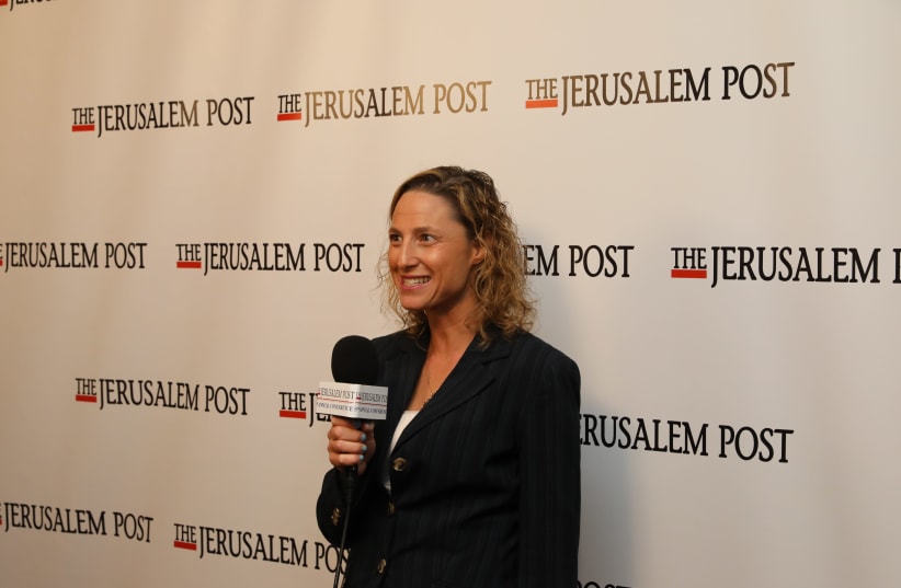 Jerusalem Post news editor Maayan Hoffman interviews people behind the scenes at the annual conference (photo credit: MARC ISRAEL SELLEM/THE JERUSALEM POST)