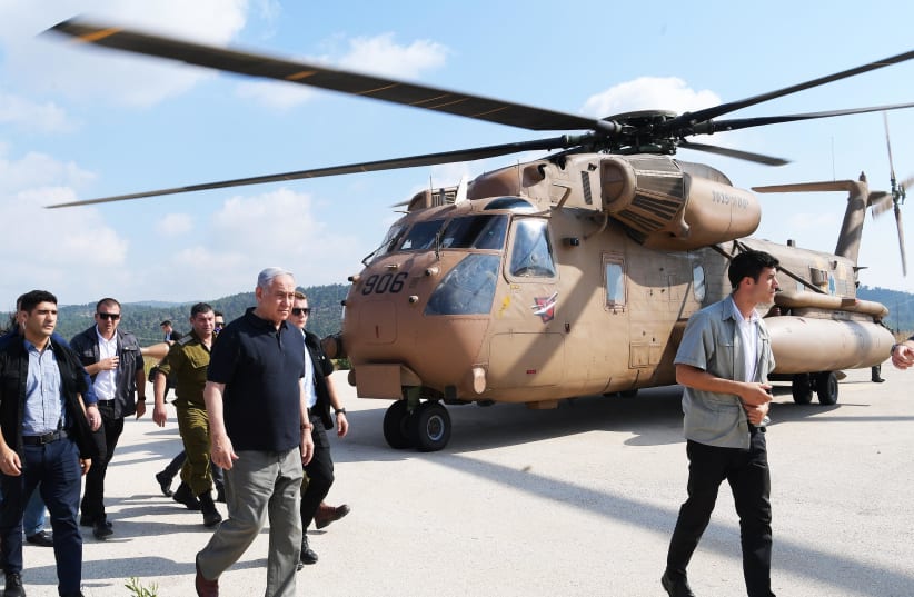 Prime Minister Benjamin Netanyahu at an army exercise in the north on June 19th, 2019 (photo credit: AMOS BEN-GERSHOM/GPO)