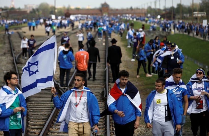 Youth attend the annual March of the Living at the former Nazi concentration camp of Auschwitz on May 2, 201 (photo credit: KASPER PEMPEL/REUTERS)