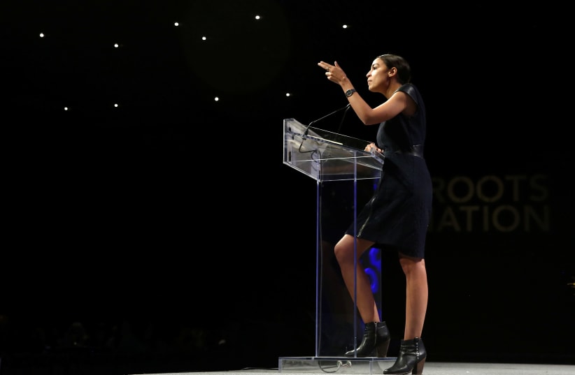 Alexandria Ocasio-Cortez speaks at the Netroots Nation annual conference for political progressives in New Orleans (photo credit: JONATHAN BACHMAN/REUTERS)