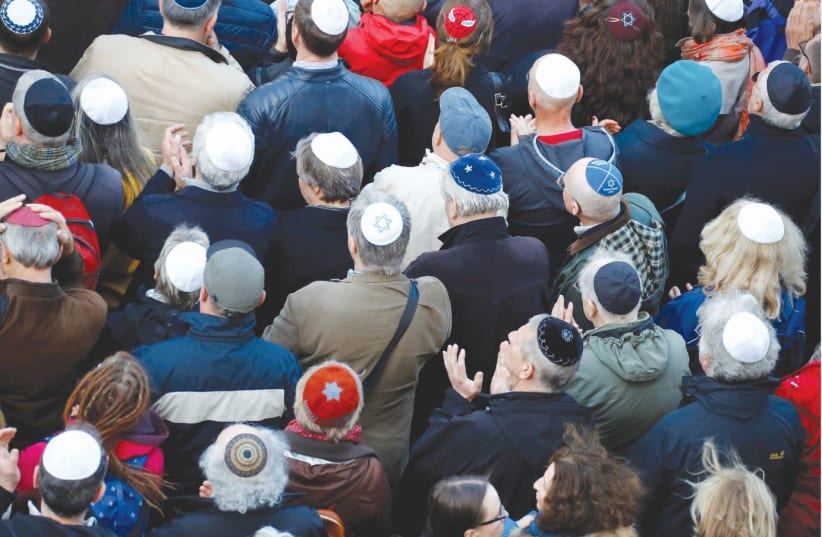  A kippah demonstration in front of a synagogue in Berlin (photo credit: REUTERS)