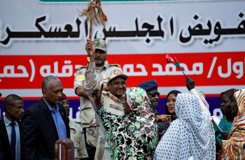 Lieutenant General Mohamed Hamdan Dagalo greets his supporters during a meeting in Khartoum, Sudan. (photo credit: REUTERS/UMIT BEKTAS)
