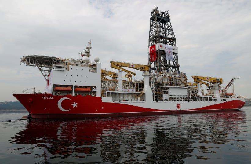 Turkish drilling vessel Yavuz sets sail in Izmit Bay, on its way to the Mediterranean Sea, off the port of Dilovasi, Turkey, June 20, 2019 (photo credit: MURAD SEZER/REUTERS)