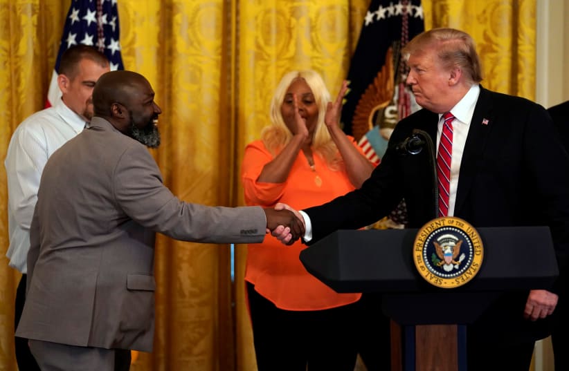 Matthew Charles, former prisoner and FIRST STEP Act Beneficiary, thanks U.S. President Donald Trump during the 2019 Prison Reform Summit and First Step Act Celebration at the White House in Washington, U.S., April 1, 2019.  (photo credit: YURI GRIPAS/REUTERS)