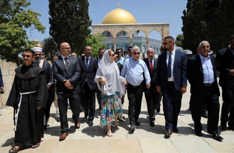 The Dome of the Rock is seen in the background as Chilean President Sebastian Pinera and his wife Cecilia Morel walk on the compound known to Muslims as Noble Sanctuary and to Jews as Temple Mount, during their visit to Jerusalem's Old City June 25, 2019 (photo credit: REUTERS/AMMAR AWAD)