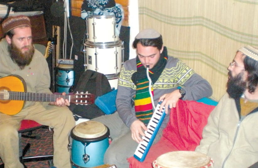 (FROM RIGHT) Yehuda Leuchter, Rafael Barkatz and Shmuel Caro of the band Aharit Hayamim rehearse in 2009. (photo credit: BEN BRESKY)
