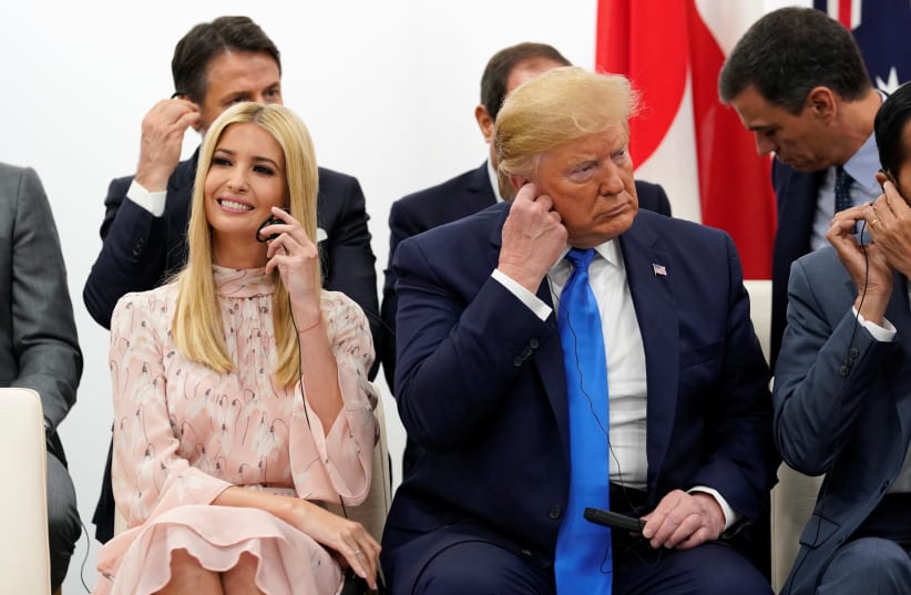 U.S. President Donald Trump and White House senior advisor Ivanka Trump attend a women's empowerment event during the G20 leaders summit in Osaka, Japan, June 29, 2019.  (photo credit: KEVIN LAMARQUE/REUTERS)