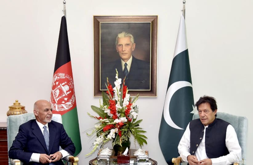 Pakistan's Prime Minister Imran Khan meets with Afghanistan's President Ashraf Ghani in Islamabad (photo credit: HANDOUT/REUTERS)
